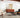 Soft silver and spice-colored Loloi Rugs Axel AXE-02 rug displayed in a cozy living room scene.