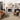 Beige and multi-colored Loloi Rugs Helena rug with intricate pattern, shown on a clean wooden floor.