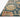 Loloi Rugs Padma PMA-03 navy and multi-color area rug with intricate geometric patterns, shown on a light hardwood floor.