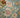 Loloi Rugs Padma PMA-04 teal and multi-colored woven rug with intricate patterns displayed on a broom scene background.