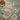 Loloi Rugs Padma PMA-04 teal and multi-colored woven rug with intricate patterns displayed on a broom scene background.