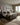 Natural and tan Roman Loloi Rugs ROM-01 NATURAL / BARK with textured woven design, displayed on a neutral floor.