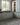 Loloi Rugs Sonnet SNN-07 Charcoal and Mist rug with intricate pattern, shown in a cozy living room setting