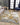 KAS Luna 7149 Gold and Grey Watercolors rug showing a soft, textured design in gold and grey tones on a neutral background.
