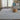 Nourison Silk Shadows SHA18 grey and blue rug with intricate pattern on soft fabric surface.