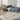 Nourison Irradiant IRR01 black and cream rug with geometric pattern, plush texture, and rectangular shape.