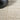 Nourison Impressions IMP01 Sand rug with a soft, neutral design in 5'3" x 7'3" size, featuring textured, plush surface.