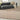 Beige Nourison Spun SPN01 rug with a plush texture, measuring 5'3" x 7'3". Soft, woven area rug for modern interior decor.