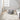 Nourison Wander WND01 ivory grey rug with geometric pattern on beige background in a modern living room setting.