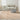 Nourison Wander WND01 natural rug in an elegant living room setting, showcasing its soft texture and neutral tones.