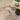 Nourison Christopher Guy S/Wl CGS35 Sand rug, 6x9 feet, with a soft beige color and intricate woven pattern.