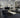 Christopher Guy Wool & Silk CGS22 Noir rug in an 8x10 size, featuring a luxurious black and cream pattern in a modern living room.
