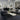 Christopher Guy Wool & Silk CGS22 Noir rug in an 8x10 size, featuring a luxurious black and cream pattern in a modern living room.
