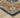 Indoor rug by Oriental Weavers, Andorra 2281E, featuring a detailed pattern in a 10x3.2 foot size.