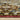 Indoor rug by Oriental Weavers, Andorra 2408A, with intricate geometric patterns in neutral tones, measuring 10x3.2 feet.