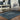 Oriental Weavers Andorra indoor rug with 10x3.2 ft geometric pattern in neutral tones, perfect for living room or bedroom decor.