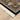 Indoor rug by Oriental Weavers, Masterpiece 1802B, 2.3x10 feet with intricate patterns and warm colors.