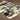 Indoor rug by Oriental Weavers, Bowen 109E, featuring a detailed pattern in neutral tones, measuring 2.3 x 7.6 feet.