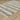 Indoor rug by Oriental Weavers, Raylan / RAY11, with intricate pattern in neutral tones, measuring 2.3 x 7.6 feet.