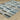 Indoor rug by Oriental Weavers, Reed RE05A, 2.3 x 7.6 feet with intricate woven pattern and neutral tones.