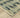 Indoor rug by Oriental Weavers, Reed RE07B, featuring a 2.3 x 7.6-foot design with intricate patterns and neutral tones.