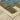 Indoor rug by Oriental Weavers, Reed RE11Q, measuring 2.3 x 7.6 feet, with a detailed geometric pattern in neutral tones.