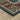 Corner view of the Oriental Weavers Vivian VI05A indoor rug featuring intricate patterns and warm colors.