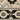 Indoor rug by Oriental Weavers, 2x3 feet Acacia ACA09 with a detailed, textured design in warm earthy tones.